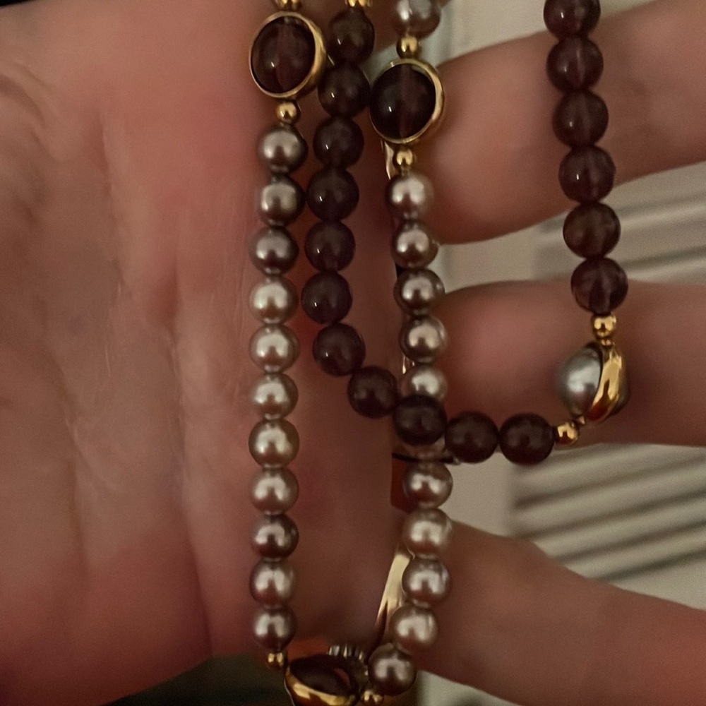 Completely complimentary necklaces.  One purple other grayish lighter purpleish